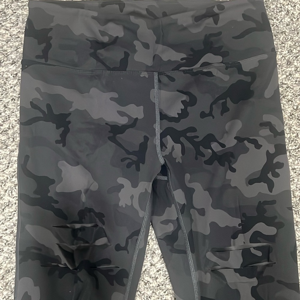 Distressed knees camo leggings.  7/8 length ZYIA size 8-10 gently used